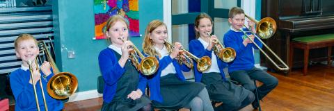 Pupils playing brass instruments